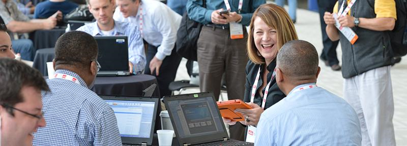 people laughing at a business conference